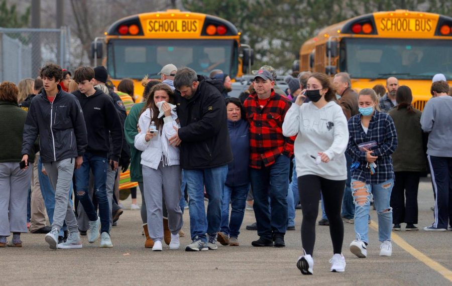 Students and parents run to safety, following the deadly shooting at Oxford High School.