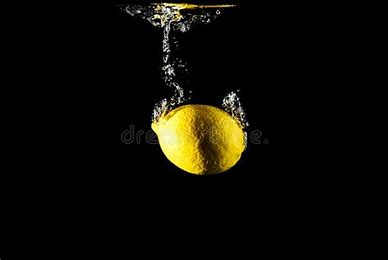 Lemon Dropped in water (stock image)