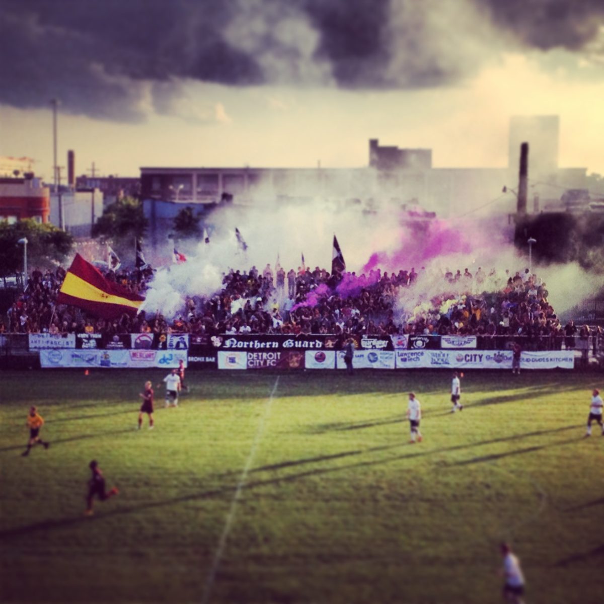 Fans set off smoke bombs at a game.